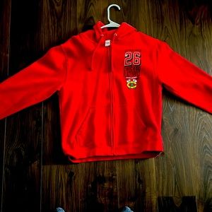 Blackhawks zip up. Never worn. Medium. Red